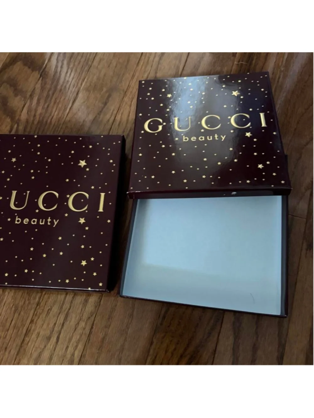 Gucci Beauty makeup boxes with gold stars on a dark background Set of 2 empty Gu